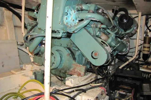 Slide: The Image of Engine room of 1973 Chris-Craft 55 Commander with visible machinery and wiring. - 73