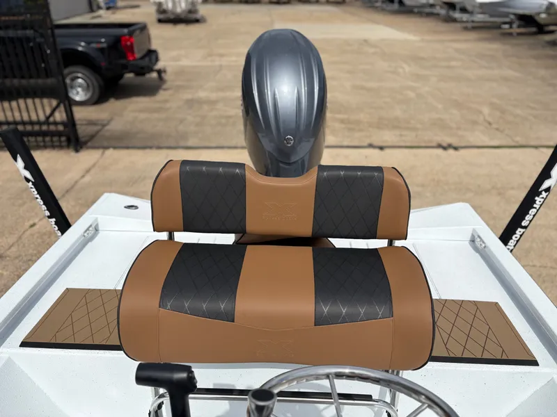 Slide: The Image of 2026 Xpress H210B boat with brown and black seats. - 4