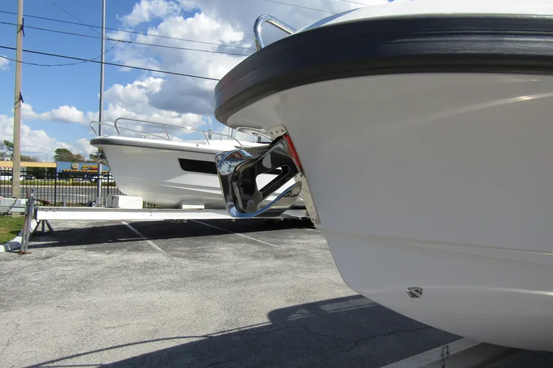 Slide: The Image of Front view of a 2026 Nimbus Tender 9 boat on a parking lot. - 8
