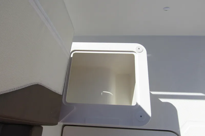 Slide: The Image of Interior of Nimbus Tender 9, 2026 model, featuring storage compartment. - 33