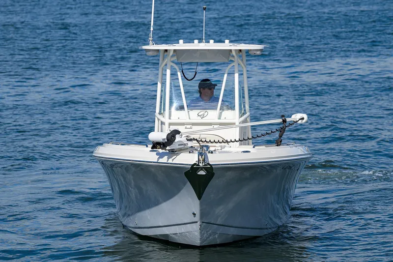 Slide: The Image of 2022 Sailfish 242 CC boat cruising on open water. - 3