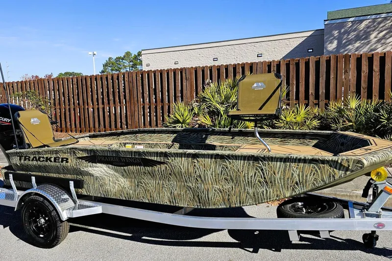 Slide: The Image of 2026 Tracker Grizzly 1650 T Prairie Wings Edition boat on trailer, camo design. - 3