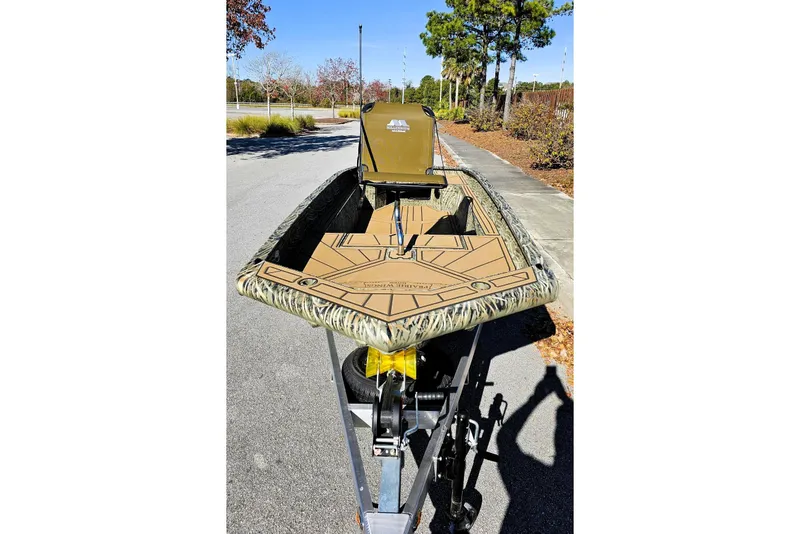 Slide: The Image of 2026 Tracker Grizzly 1650 T Prairie Wings Edition boat on trailer, outdoor setting. - 5