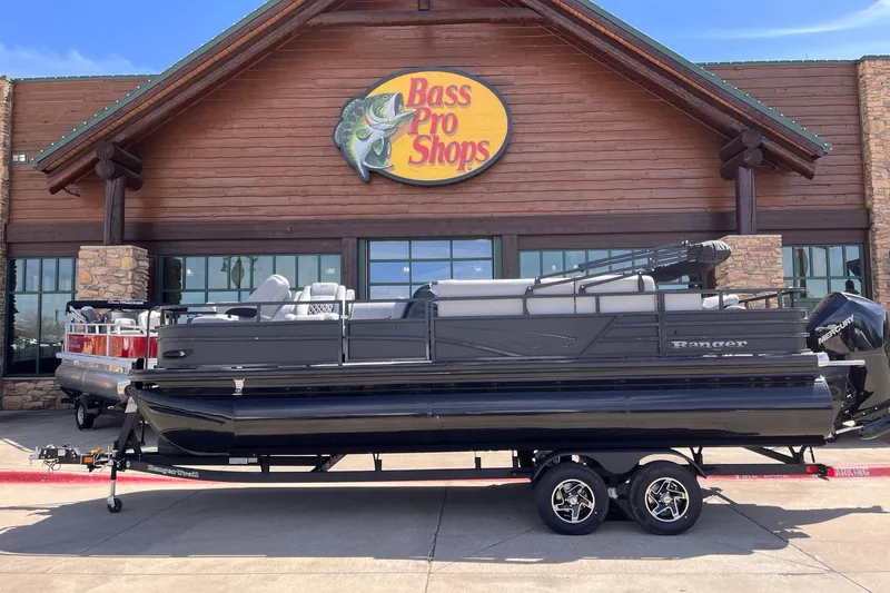 The Image of 2026 Ranger 223FC pontoon boat displayed outside Bass Pro Shops. - 1