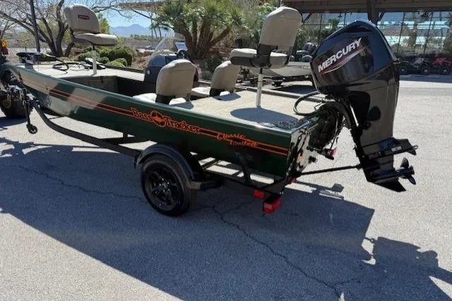 Slide: The Image of 2026 Tracker Bass Tracker Classic Limited boat with Mercury outboard motor on trailer. - 2