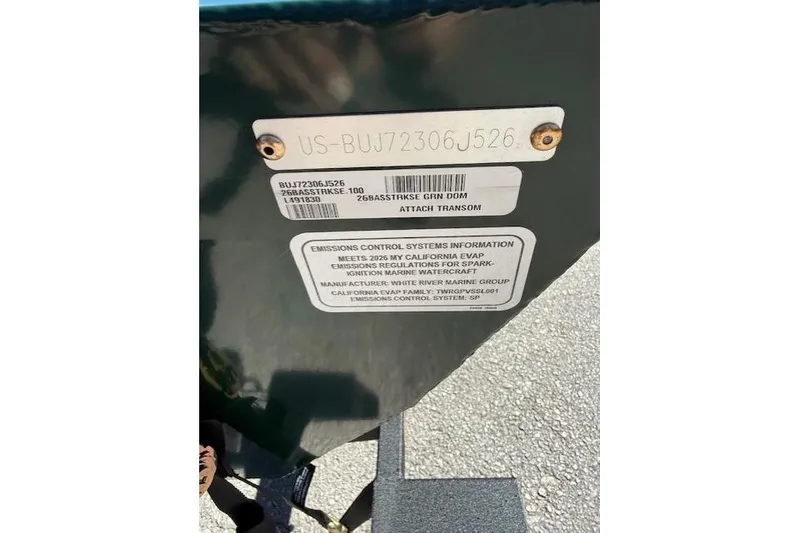 Slide: The Image of 2026 Tracker Bass Tracker Classic Limited transom with emissions control information. - 7