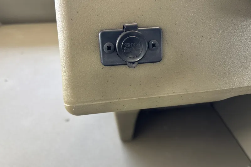 Slide: The Image of Power outlet on 2026 Tracker Grizzly 1648 SC boat dashboard. - 18