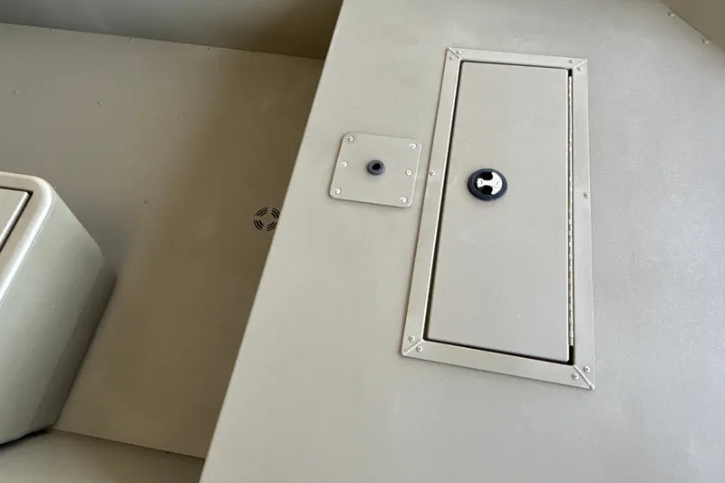 Slide: The Image of Interior view of 2026 Tracker Grizzly 1648 SC boat, featuring storage compartment. - 13