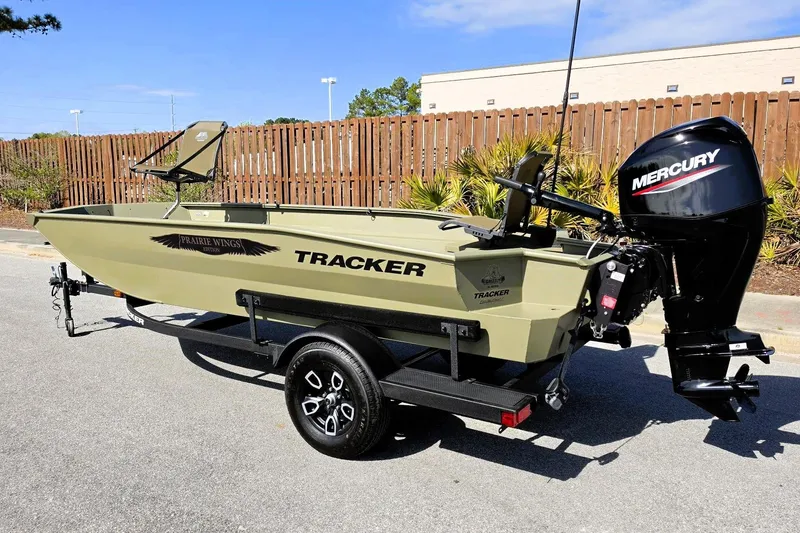 Slide: The Image of 2026 Tracker Grizzly 1650 T Prairie Wings Edition boat with Mercury engine on trailer. - 10