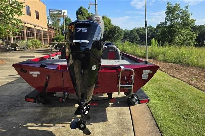 Slide: The Image of 2026 Ranger RT178 boat with Mercury 75 engine, parked outdoors on a sunny day. - 2