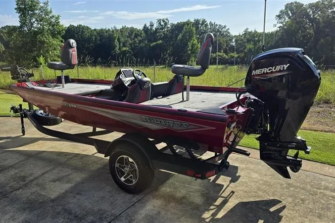 Slide: The Image of 2026 Ranger RT178 boat with Mercury engine, parked outdoors on a sunny day. - 1
