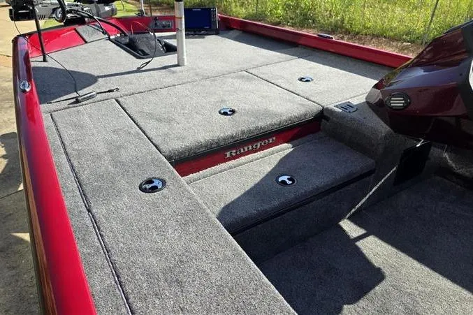 Slide: The Image of 2026 Ranger RT178 boat deck with gray carpet and storage compartments. - 8