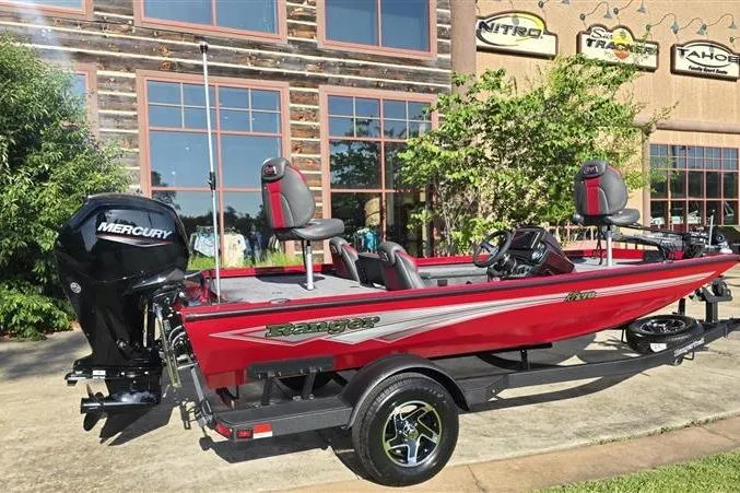 Slide: The Image of 2026 Ranger RT178 boat in vibrant red, parked outdoors with Mercury engine. - 3