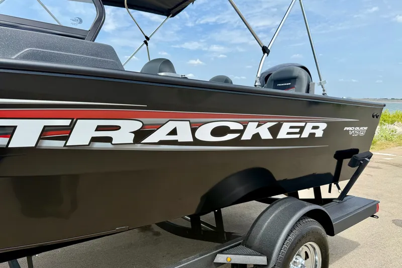 Slide: The Image of 2026 Tracker Pro Guide V-175 Combo boat on trailer, side view with logo. - 17