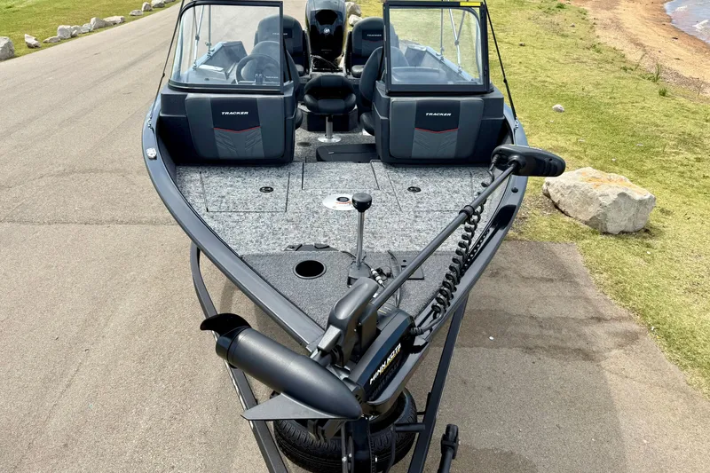 Slide: The Image of 2026 Tracker Pro Guide V-175 Combo boat on a lakeside road. - 14