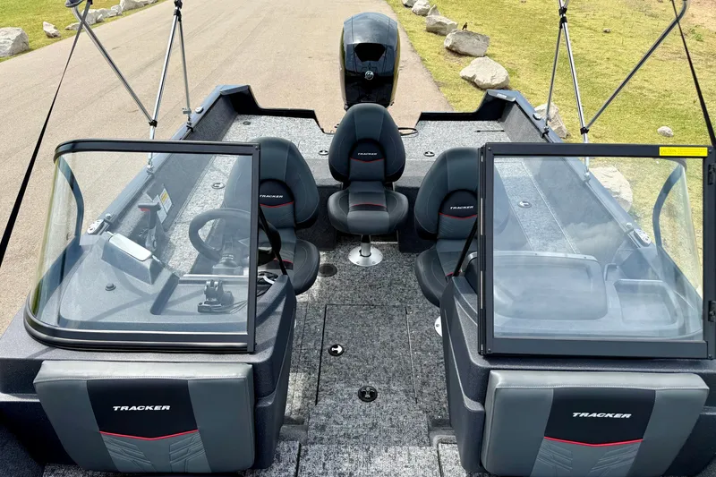 Slide: The Image of 2026 Tracker Pro Guide V-175 Combo boat interior with seating and steering wheel. - 8