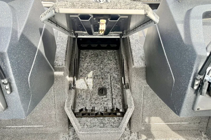 Slide: The Image of 2026 Tracker Pro Guide V-175 Combo boat storage compartment with open lid, showcasing interior space. - 12