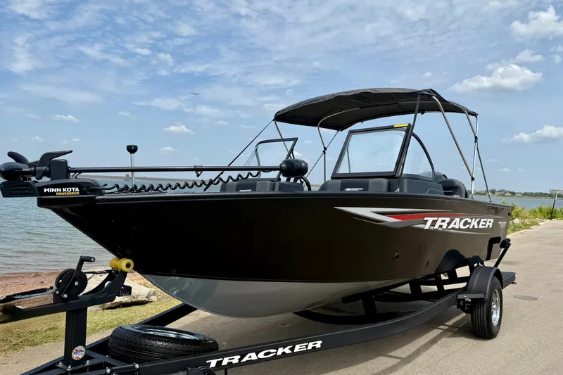Slide: The Image of 2026 Tracker Pro Guide V-175 Combo boat on trailer by the water. - 15