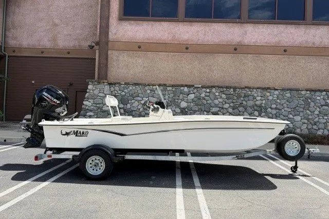 The Image of 2026 Mako Pro Skiff 17 CC boat on trailer, parked outdoors. - 0
