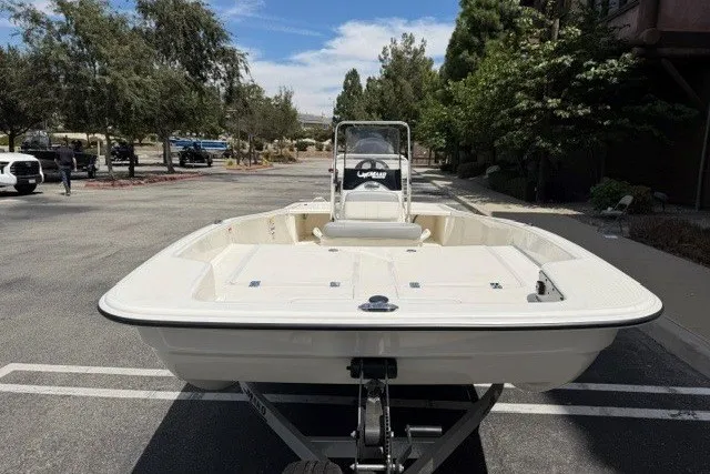 Slide: The Image of 2026 Mako Pro Skiff 17 CC boat on trailer in parking lot. - 8