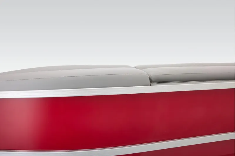 Slide: The Image of 2026 Sun Tracker Party Barge 22 DLX interior seating with gray upholstery and red accents. - 78