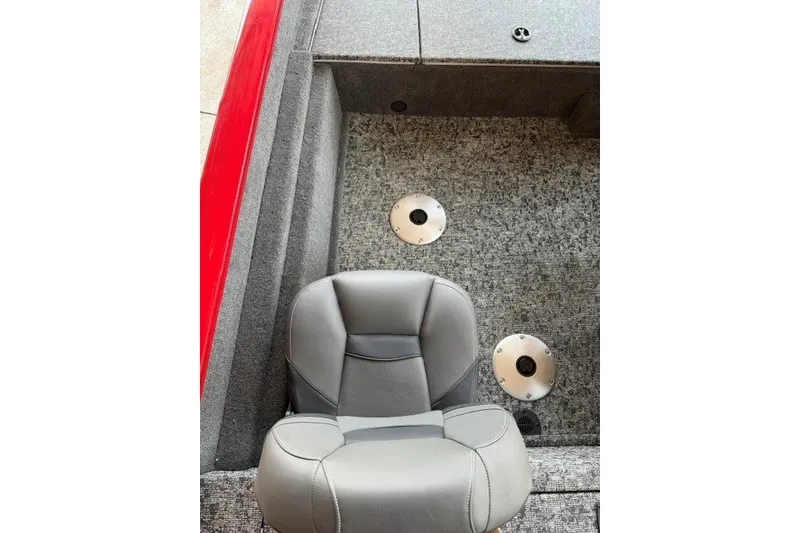 Slide: The Image of 2026 Tracker Pro Team 175 Crappie Edition boat interior with gray seat and carpeted floor. - 12