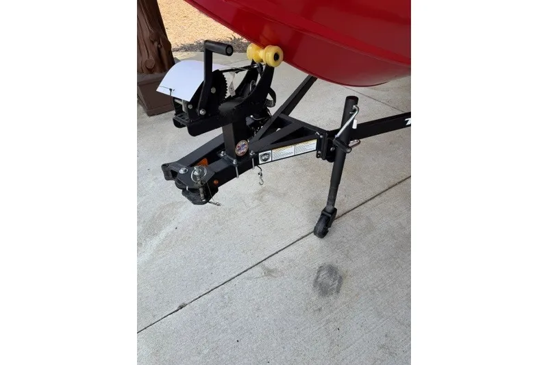 Slide: The Image of Trailer hitch of 2026 Tracker Pro Team 175 Crappie Edition boat on concrete surface. - 13