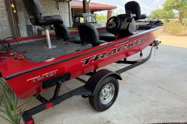 The Image of 2026 Tracker Pro Team 175 Crappie Edition boat, red exterior, parked on a trailer. - 0