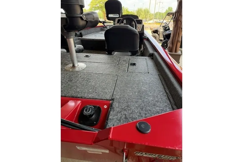 Slide: The Image of 2026 Tracker Pro Team 175 Crappie Edition boat interior with gray carpet and seating. - 5