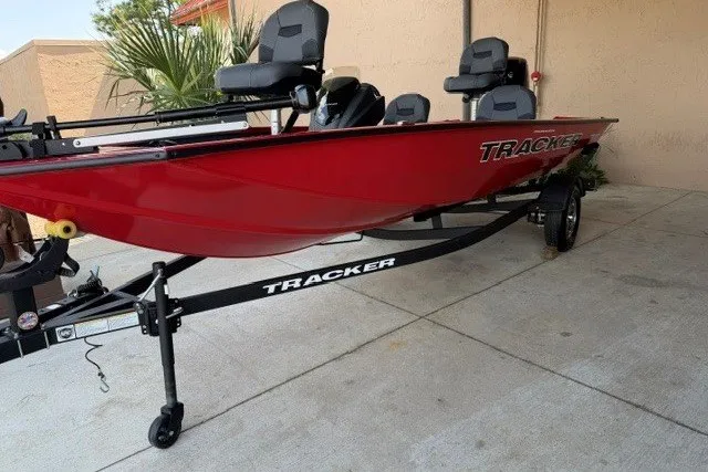 Slide: The Image of 2026 Tracker Pro Team 175 Crappie Edition boat in vibrant red on trailer. - 2