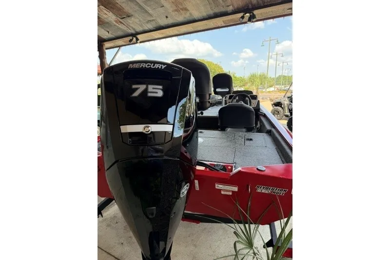 Slide: The Image of 2026 Tracker Pro Team 175 Crappie Edition boat with Mercury 75 engine, parked outdoors. - 3