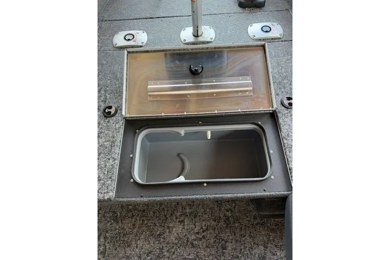 Slide: The Image of 2026 Tracker Pro Team 175 Crappie Edition boat livewell with open lid. - 11