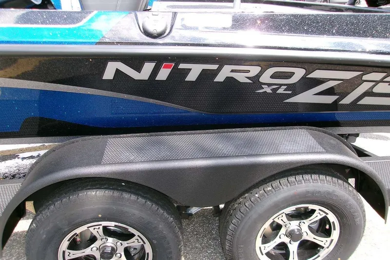 Slide: The Image of 2026 Nitro Z19 XL boat trailer with dual wheels and sleek design. - 6