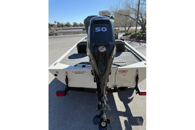 Slide: The Image of 2026 Tracker Pro 170 boat with Mercury 50 HP outboard motor, parked outdoors. - 4