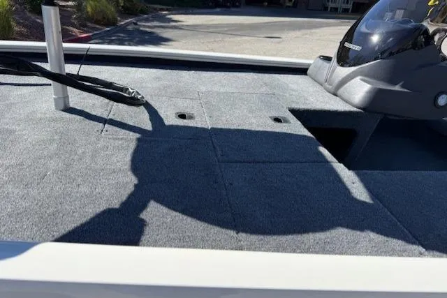 Slide: The Image of 2026 Tracker Pro 170 boat deck with storage compartments and control panel. - 7