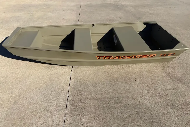 The Image of 2026 Tracker Grizzly 10 Jon boat on concrete surface, showcasing its compact design. - 0