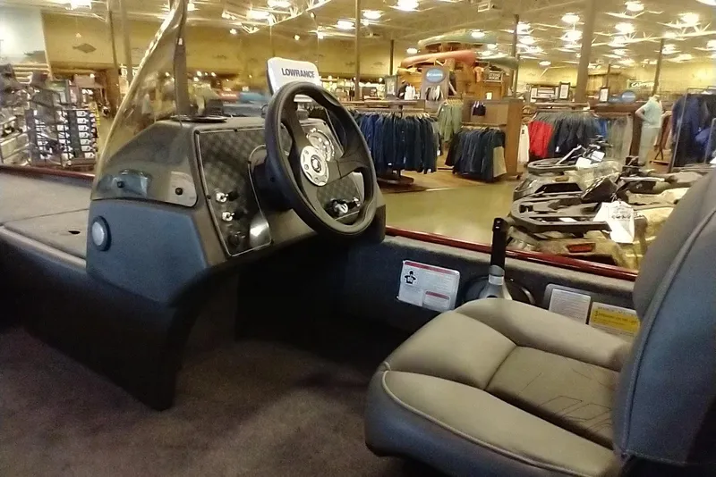 Slide: The Image of Interior of 2026 Tracker Bass Tracker Classic XL boat in showroom setting. - 6