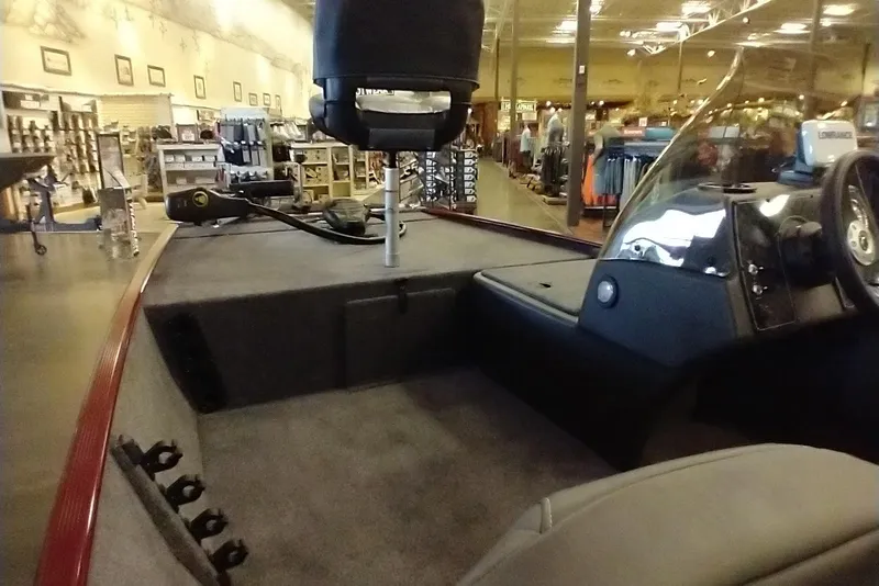 Slide: The Image of 2026 Tracker Bass Tracker Classic XL boat interior in showroom setting. - 9