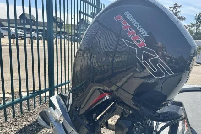 Slide: The Image of Mercury Pro XS engine on a 2026 Nitro Z18 Pro boat, parked near a fence. - 102