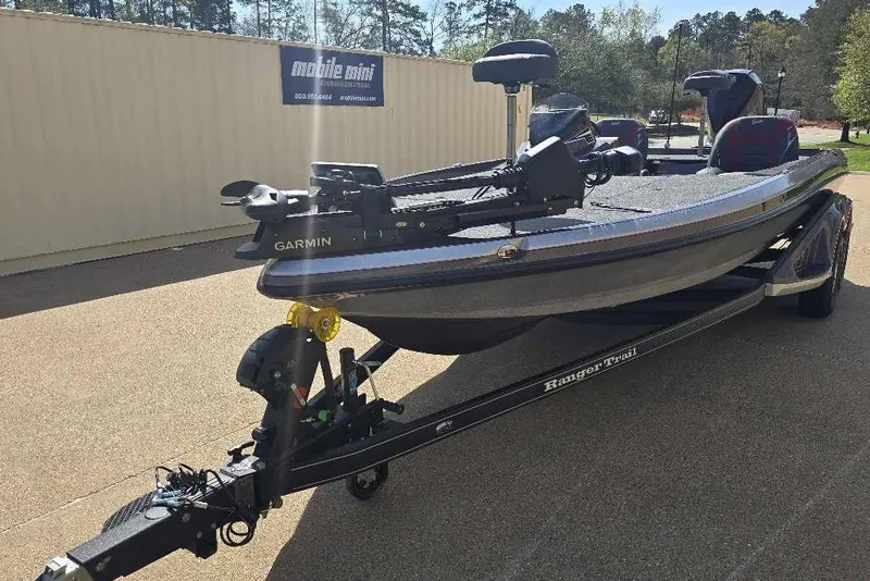 Slide: The Image of 2026 Ranger Z521 boat on trailer with Garmin equipment, parked outdoors. - 11