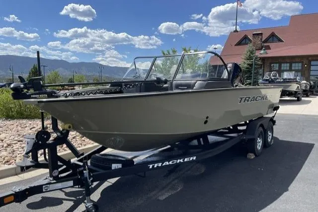 The Image of 2026 Tracker Targa V-19 WT boat on trailer, parked outdoors under a clear sky. - 0
