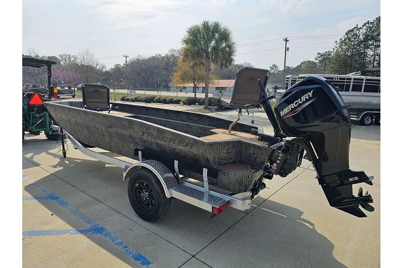 Slide: The Image of 2026 Tracker Grizzly 1650 T Prairie Wings Edition boat with Mercury engine on trailer. - 10