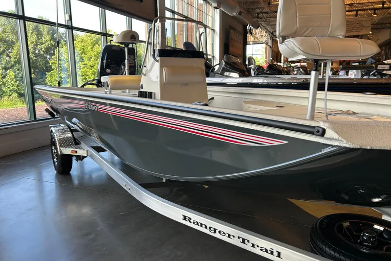 Slide: The Image of 2026 Ranger RB190 boat in showroom, featuring sleek design and modern seating. - 1