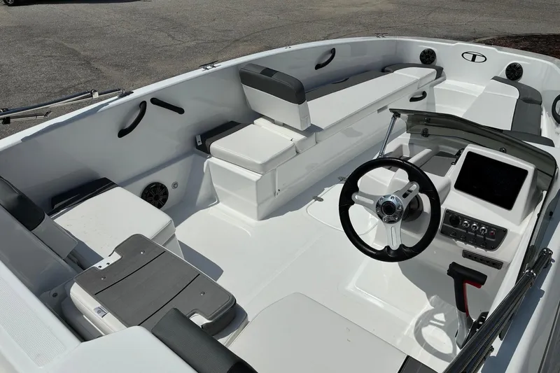 Slide: The Image of 2026 Tahoe T18 boat interior with steering wheel, seating, and control panel. - 67