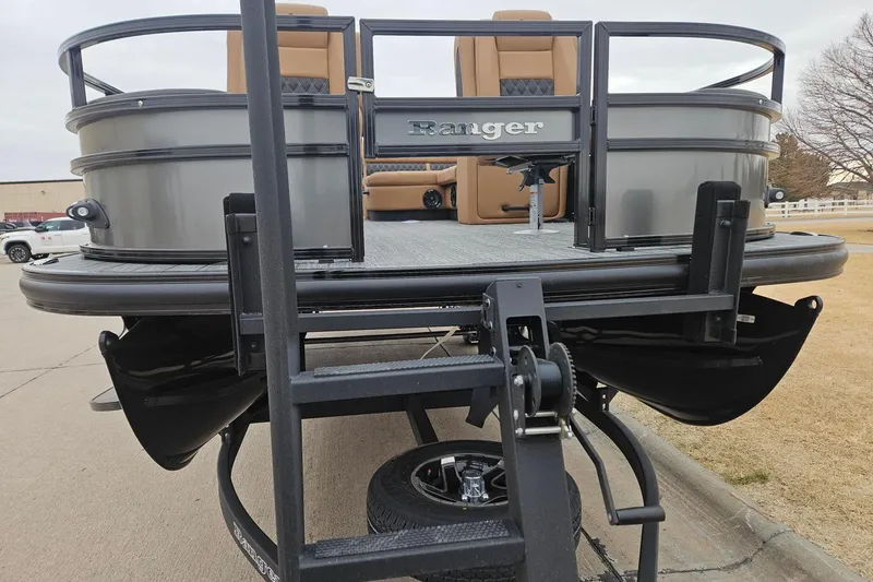 Slide: The Image of 2026 Ranger 220F pontoon boat on trailer, featuring sleek design and comfortable seating. - 80