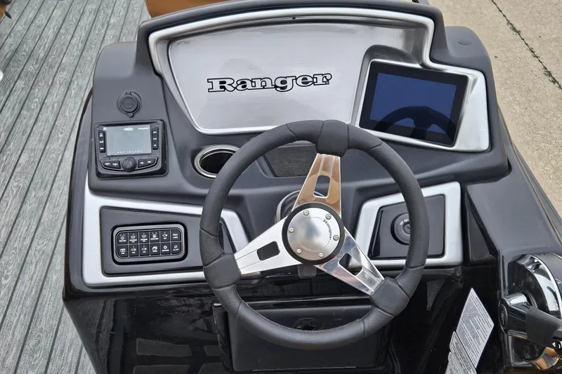Slide: The Image of 2026 Ranger 220F boat dashboard with steering wheel and electronic controls. - 81