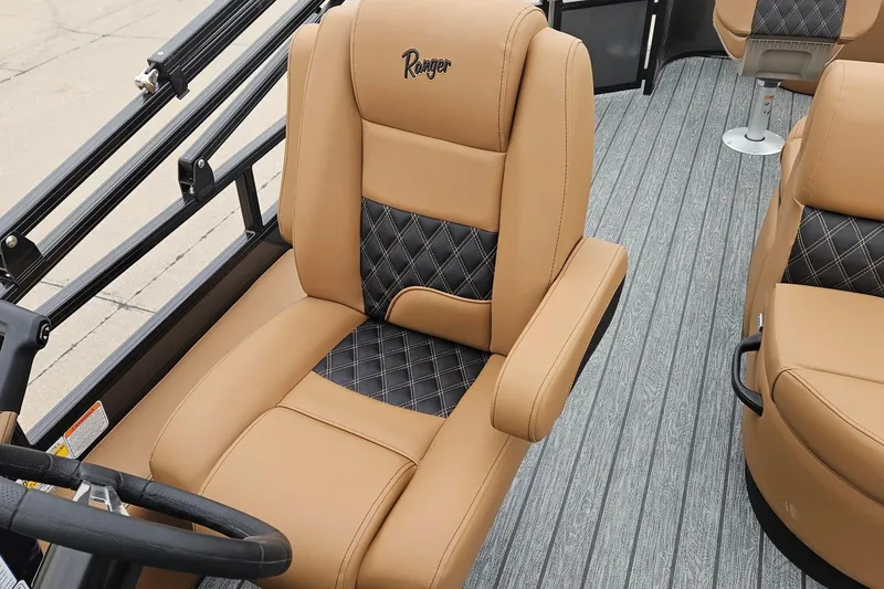 Slide: The Image of 2026 Ranger 220F boat interior with tan and black diamond-stitched seating. - 83