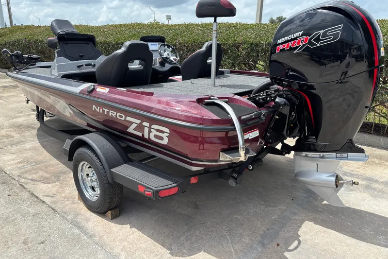 Slide: The Image of 2026 Nitro Z18 boat with Mercury Pro XS engine, parked on a trailer. - 2