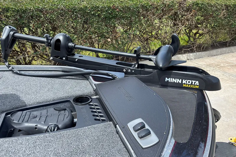 Slide: The Image of 2026 Nitro Z18 boat with Minn Kota Maxxum trolling motor on deck. - 7