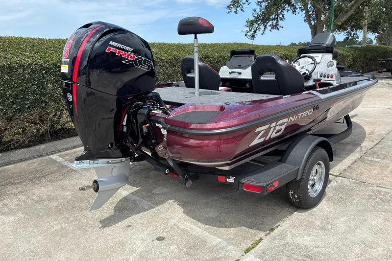 Slide: The Image of 2026 Nitro Z18 boat with Mercury Pro XS engine, parked on a trailer. - 4